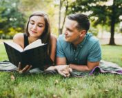 Atlanta Engagement Session Piedmont Park Reading a book Atlanta Wedding Photographers