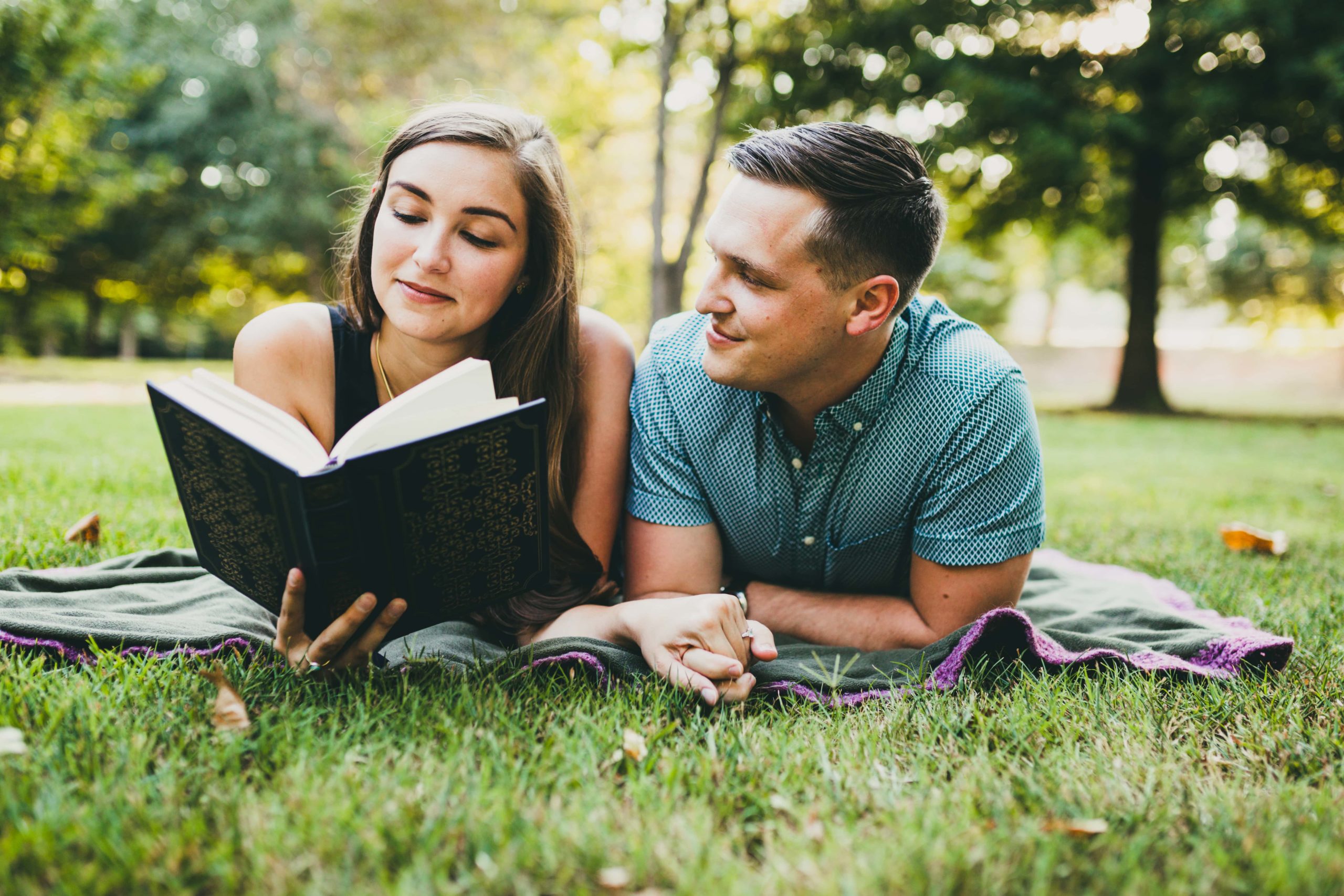 Atlanta Engagement Session Piedmont Park Reading a book Atlanta Wedding Photographers